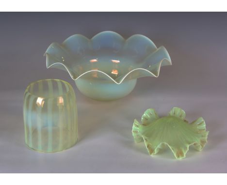 An early 20th century vaseline glass light shade by Powell, the cylindrical body with vertical line decoration, height 15.5cm
