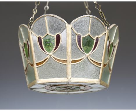 An early 20th century Arts and Crafts Glasgow School stained and leaded glass ceiling light of octagonal tapering form, heigh