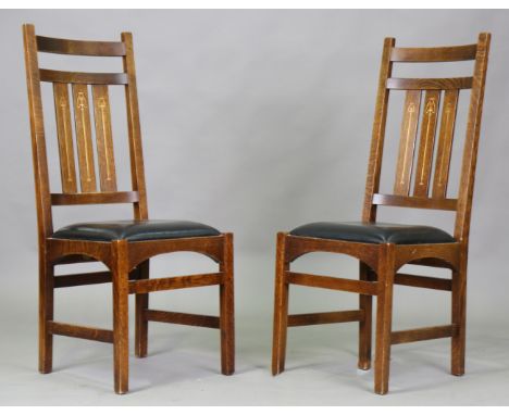 A pair of modern Arts and Crafts Stickley quarter-sawn oak-framed side chairs, after a design by Harvey Ellis, the three spat