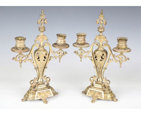 A pair of late Victorian cast gilt brass twin-light candelabra by W. Tonks &amp; Son, height 32cm, width 20cm.Buyer’s Premium