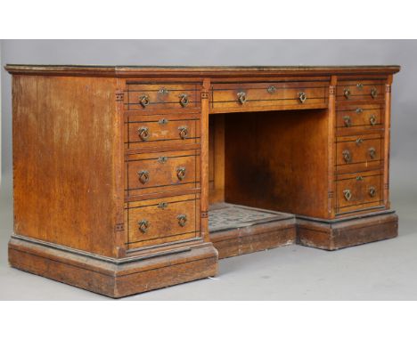 A late Victorian Aesthetic Movement oak dressing table, in the manner of Charles Eastlake, with overall inlaid ebony borders 