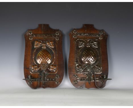 A pair of Edwardian Arts and Crafts oak and patinated copper single-light wall sconces, detailed 'Barum', initialled 'J.D.', 