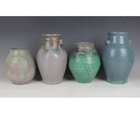 Four Upchurch Pottery vases, first half 20th century, two with Chinese style lug handles to the neck, height 25.5cm and 25cm,