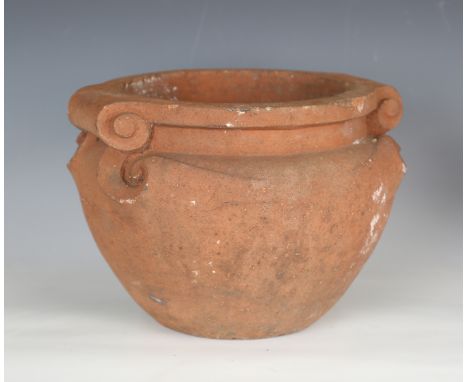 A Compton Pottery terracotta garden 'scroll' pot, thought to be designed by Mary Seton Watts, the flattened circular rim with