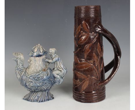 An E. Bingham Castle Hedingham pottery teapot and cover, 1870s, with blue glaze, sprigged to each side with marine motifs ben