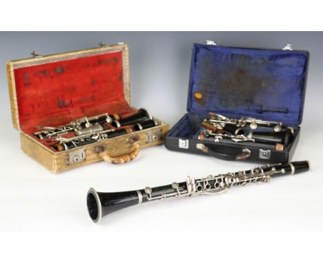 A Selmer blackwood clarinet, cased, together with a Boosey &amp; Hawkes blackwood clarinet and another clarinet by Evette.Buy