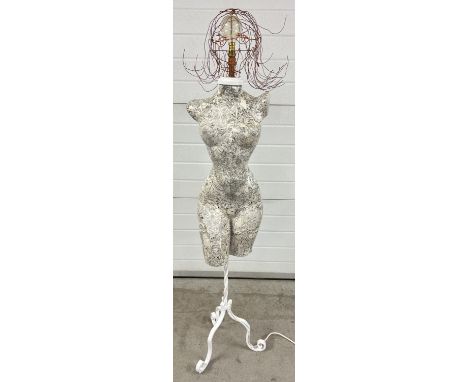 A modern design standard lamp made from a female mannequin and wire head design lampshade. With black &amp; white decoupage d