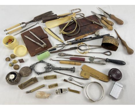A collection of assorted vintage items to include button hooks, curling tongs, buttons, leather wallets, rung making tools, t