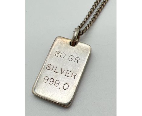 A 20g 999 silver ingot style pendant on a vintage silver 25" curb chain. Clasp marked "SIL". Total weight approx. 30.6g. 