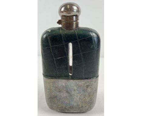 An antique silver plated and green leather covered hip flask. Hinged lid has twist lock feature. Approx. 18cm tall. 