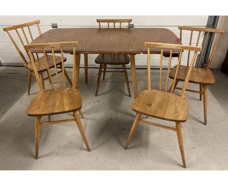 A mid century blond Ercol drop leaf dining table with 5 Ercol chairs. Rectangular shaped extending table (approx. 72cm tall x