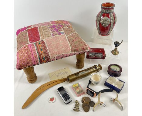 A small wooden stool upholstered with ethnic style material, together with a misc collection of items to include brass gauge,