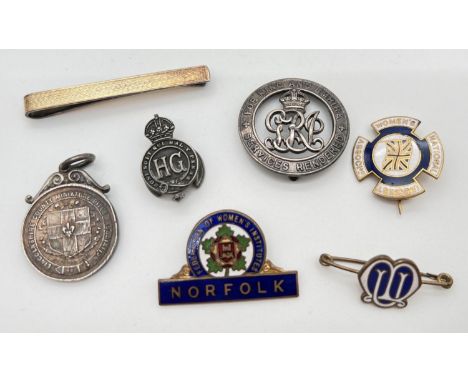 A collection of vintage badges, a medallion and a tie pin. To include a 1907 Rifle Association medal and a silver tie pin wit