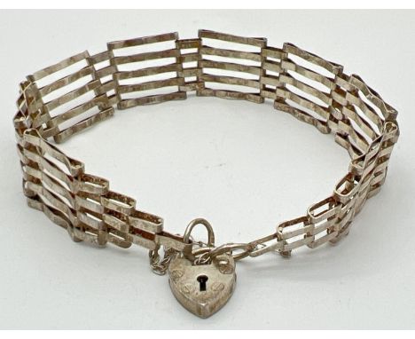 A vintage silver 5 bar gate bracelet with padlock and safety chain. Silver marks to back of padlock. Total weight approx. 7.2