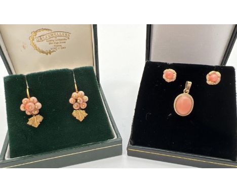 A collection of vintage gold coral set jewellery. An oval pendant with rope design mount set with a cabochon of coral. Togeth