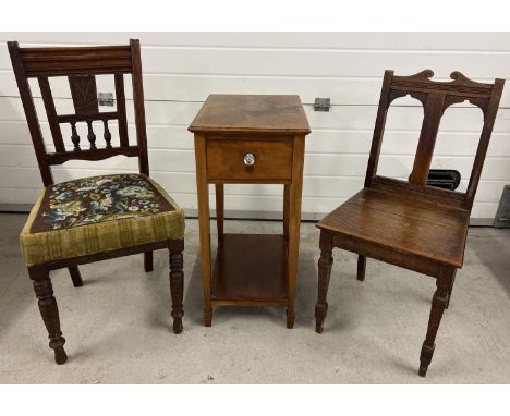 3 antique dark wood items of furniture. 2 Victorian hall chairs with carved detail together with an Edwardian lamp table with