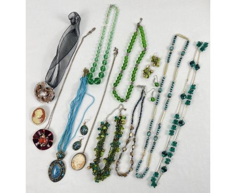 A collection of modern and vintage costume jewellery. To include statement necklaces, brooches and drop style earrings. 