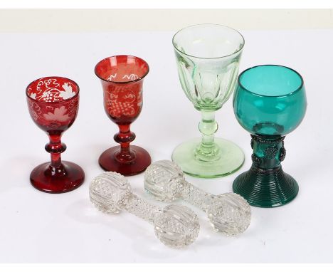 Four 19th Century drinking glasses, to include a uranium wine glass, two ruby sherry glasses and a green glass, with two hobn