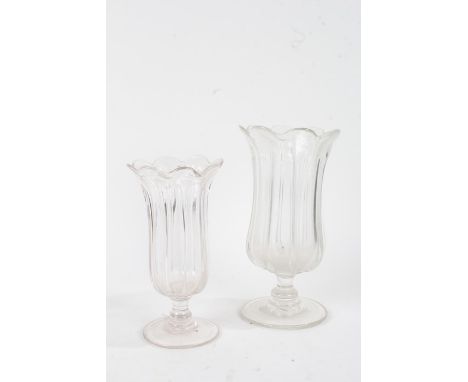 Two 19th Century glass vases, with bodies formed as tall leaves above the ring turned stem and wide, foot, 30cm high 24cm hig