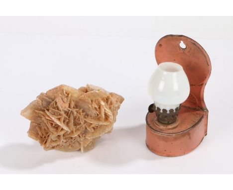 Small size tin oil lamp, with a circular disc to the back and a hanging hole above the arced body and glass shade, 15cm high,