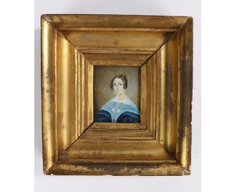 19th Century British School primitive portrait miniature, of a lady with curls in her hair wearing a blue dress, housed withi