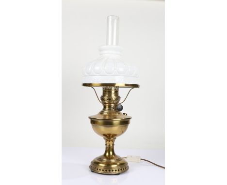 20th Century brass oil lamp (converted to electricity), having glass chimney and milk glass shade, with pierced circular foot