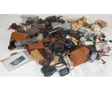 A very large collection of vintage camera bags and accessories to include bags, camera filters, lenses, bags, straps and many