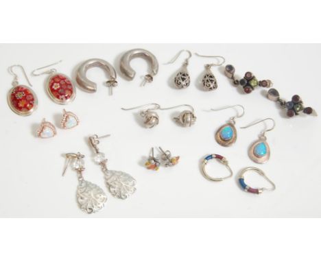 A collection of vintage ladies silver earrings to include a pair of stud back hoop earrings, a pair of drop earrings with mil