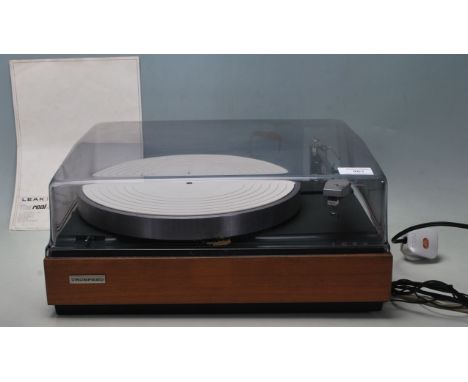 A vintage Leak truspeed transcription turntable / record player with teak wood case and transport plastic lid complete with i