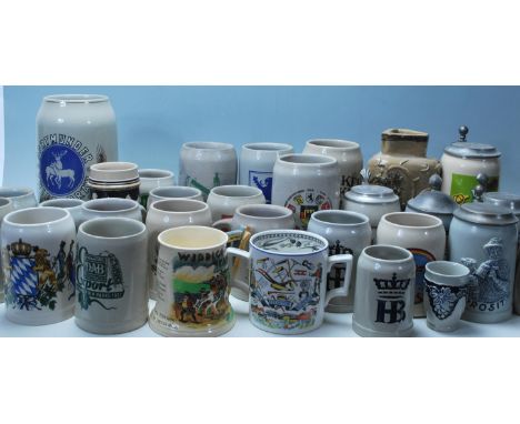 A collection of 20th Century German ceramic stein drinking tankards, each having painted advertising decoration to the sides 