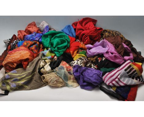 A collection of vintage ladies scarves to include some silk examples, various floral printed examples, leopard print design s