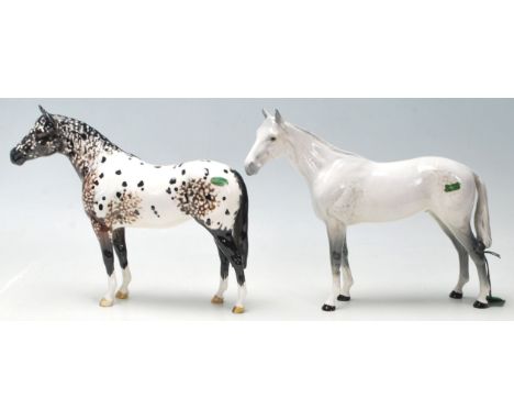 Beswick - A collection of three ceramic horses by Beswick to include a pale gray horse -&nbsp; modelled from " Bois Roussel "