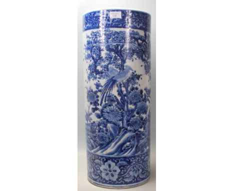 A 20th century Chinese style antique blue and white vase / stick stand with naturalistic scenes to the sides. AF.