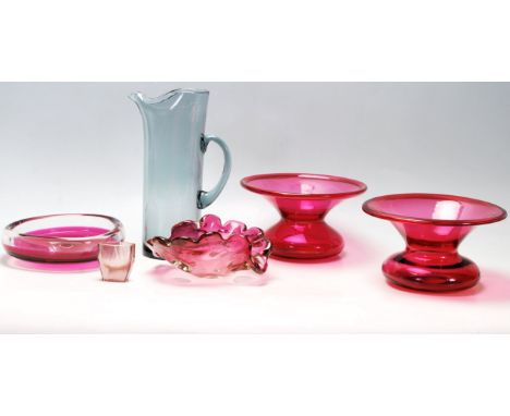 A collection of retro studio art glass to include a Czechoslovakian pink glass bowl, a grey glass pitcher jug, a pink glass l