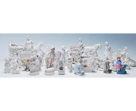 A collection of 20th Century ceramic bisque parian ware figurines to include various horse and cart figurines, figural match 