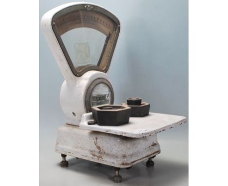 A set of vintage mid 20th century white enamel Avery countertop shop scales having double sided dial with glass, together wit