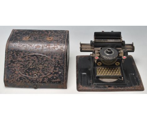 A vintage retro tin plate childs toy Junior typewriter retaining original black paintwork throughout with raised yellow butto