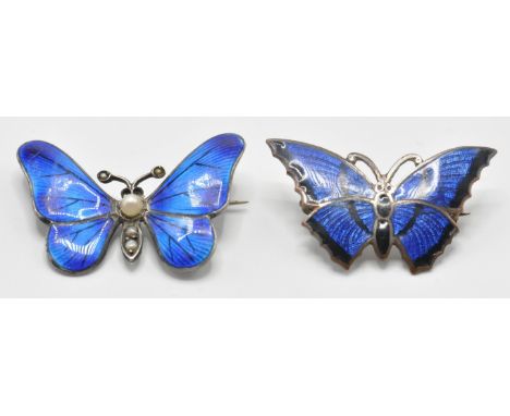 An early 20th Century silver and enamel butterfly insect brooch having blue enamelled wings set with seed pearls to the body 