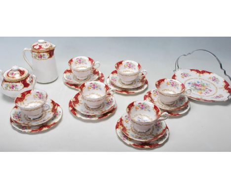 A Royal Albert Canterbury bone china tea service comprising of a trio of six cups saucers and cake pallets, sugar bowl, small