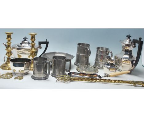 A selection of silver plate and similar wares to include a plated Thomas Wilkinson tea service comprising tea and coffee pots