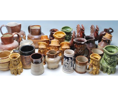 Large collection of 20th century antique lambeth stoneware jugs and cups having two tone colours with typical raised hunting 