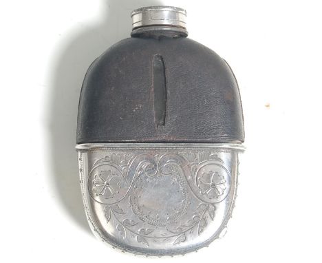 A vintage 20th Century silver white metal and glass whiskey hip flask bottle having a black leather case with a silver white 