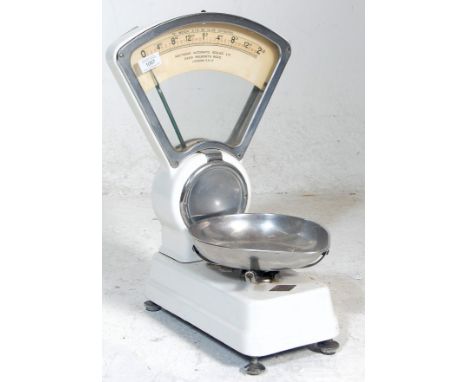 A retro vintage industrial mid century&nbsp;grocers / confectionery scales by Mattocks having white enamel decoration and met