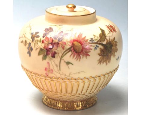 A Royal Worcester Ivory Blush lidded pot - vase. Hand painted detailing with embellished gilded foot and complete with finial