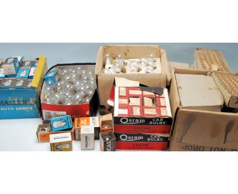 A large quantity of vintage clear and amber car headlamp / indicator bulbs by Challenge, Lucas and others, some in original b