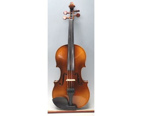 MUSICAL INSTRUMENTS: A cased Antonius Stradivarius violin complete in the protective case along with bow.  Makers label set t