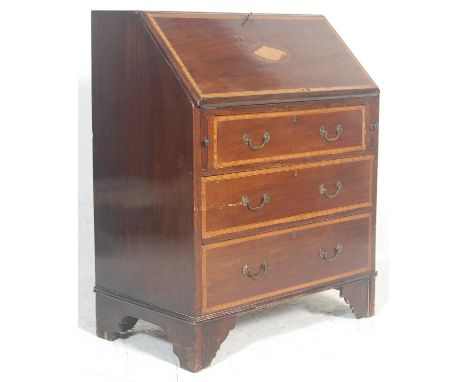 An Edwardian mahogany inlaid bureau desk. Raised on bracket feet with an upright body comprising a bank of drawers under bure