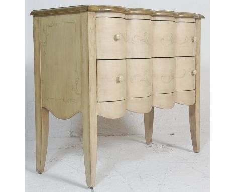 A 20th century Serpentine fronted French painted shabby chic commode chest of drawers. Raised on square tapering legs with a 