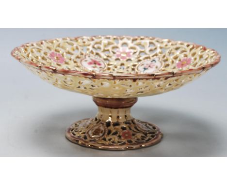 A Victorian 19th Century Hungarian - Zsolnay Pecs pierced porcelain pedestal stand of circular form having gilt edging, flora