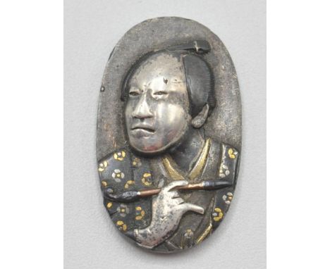 A Japanese Meji period shakudo panel of oval form being embossed with a man in traditional clothing holding an opium pipe dec